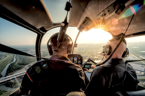 Two Pilots Flying in Helicopter